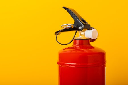 Fire Extinguisher on yellow background