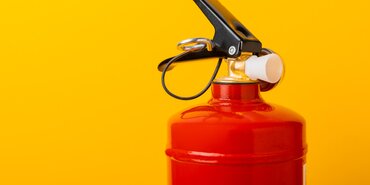 Fire Extinguisher on yellow background