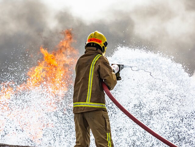 Fireman with a fire hose